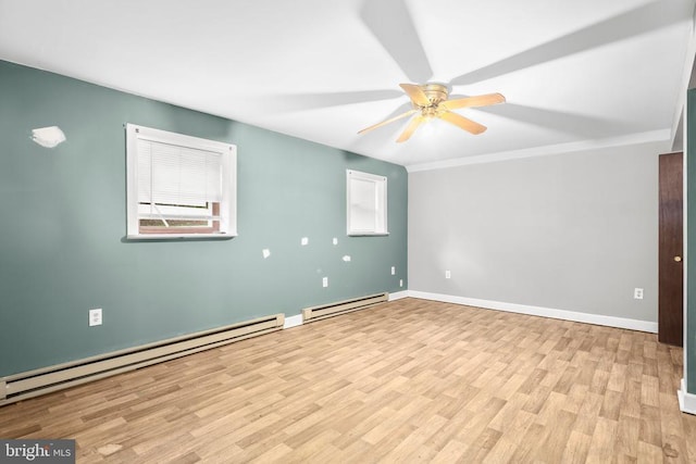 221 Hampton Dr, Spotsylvania, VA 22551 - unfurnished room featuring a baseboard heating unit, healthy amount of natural light, a ceiling fan, and wood finished floors