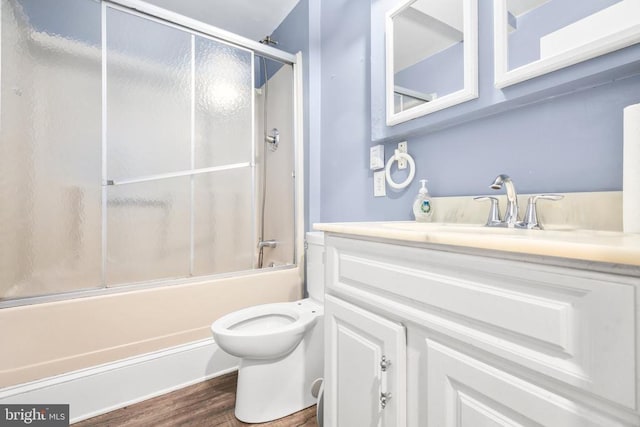 221 Hampton Dr, Spotsylvania, VA 22551 - full bath featuring vanity, bath / shower combo with glass door, and wood finished floors