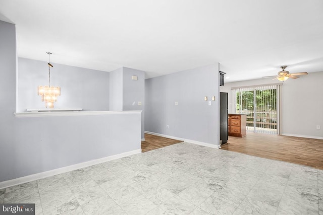 221 Hampton Dr, Spotsylvania, VA 22551 - unfurnished room with a chandelier, a ceiling fan, and tile patterned floors