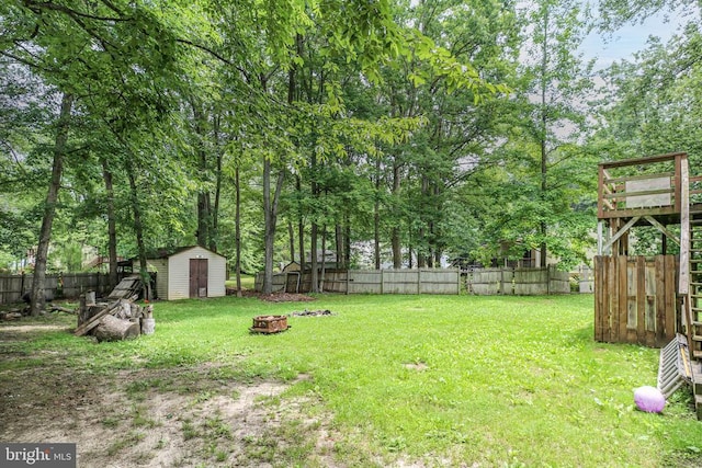 221 Hampton Dr, Spotsylvania, VA 22551 - fenced backyard featuring a shed and a fire pit