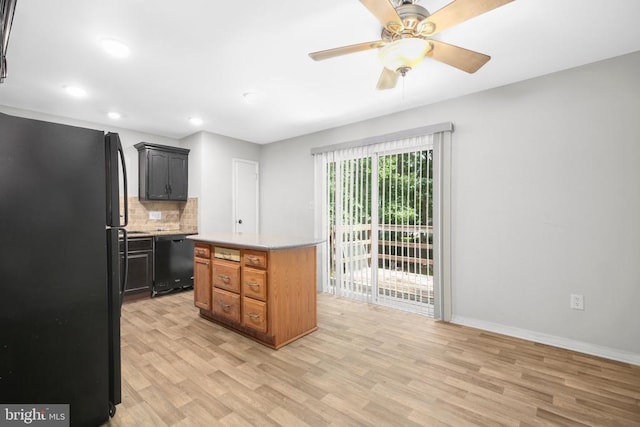 221 Hampton Dr, Spotsylvania, VA 22551 - kitchen with black appliances, light wood-style flooring, tasteful backsplash, light countertops, and recessed lighting