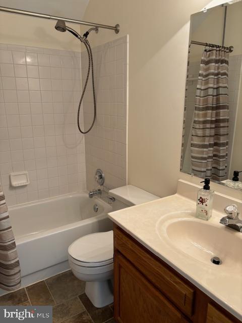 full bathroom featuring vanity and shower / tub combo with curtain