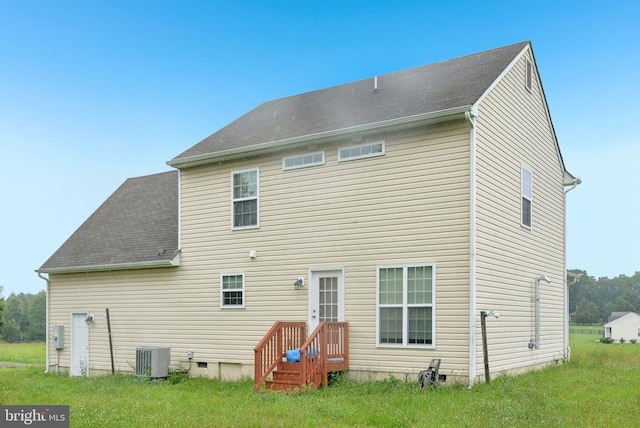  - rear view of property featuring roof with shingles