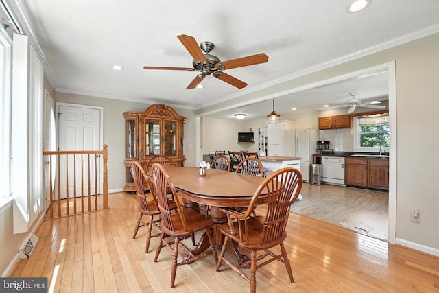  - dining area with ceiling fan, light wood finished floors, recessed lighting, and ornamental molding