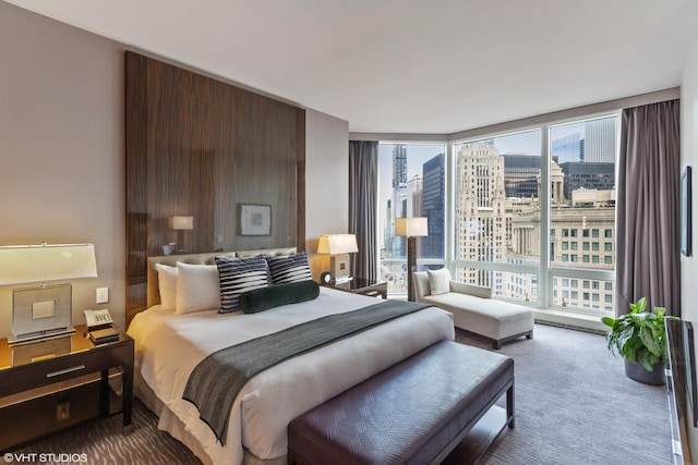 carpeted bedroom with floor to ceiling windows