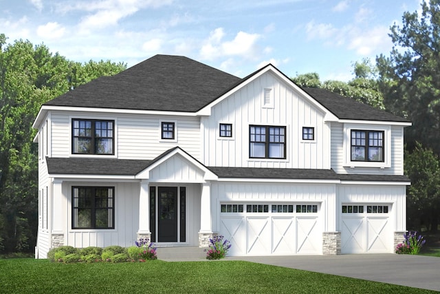 view of front facade with a front yard and a garage