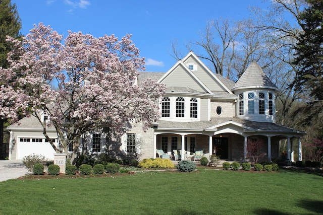 victorian home featuring a porch and a front yard