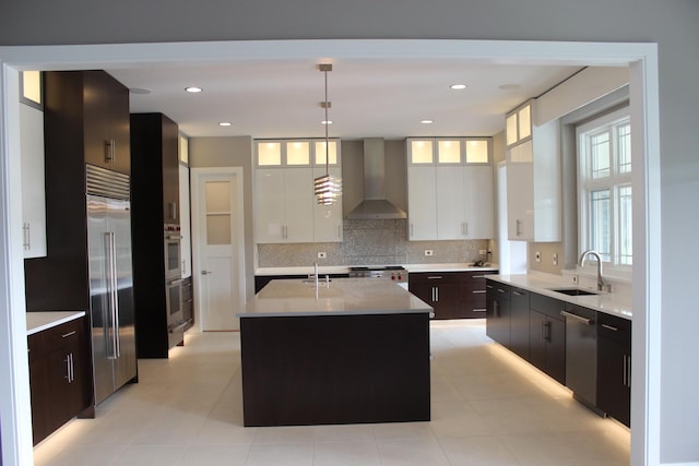 7S410 Arbor Dr, Naperville, IL 60540 - kitchen featuring a center island with sink, white cabinetry, wall chimney exhaust hood, and sink