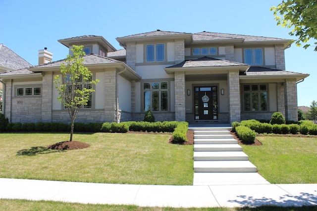 prairie-style house featuring a front yard