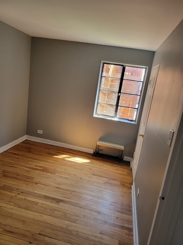 spare room with light hardwood / wood-style flooring