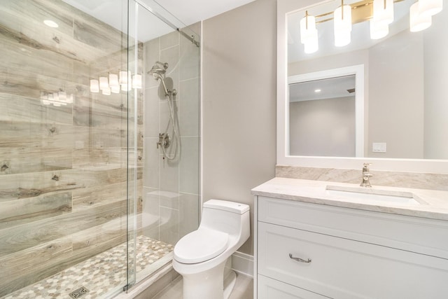 bathroom featuring an enclosed shower, toilet, and vanity