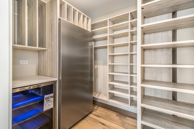 pantry with wine cooler