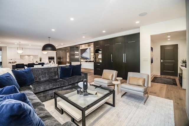 living room with light hardwood / wood-style floors