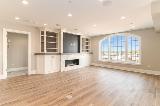 unfurnished living room featuring light hardwood / wood-style floors