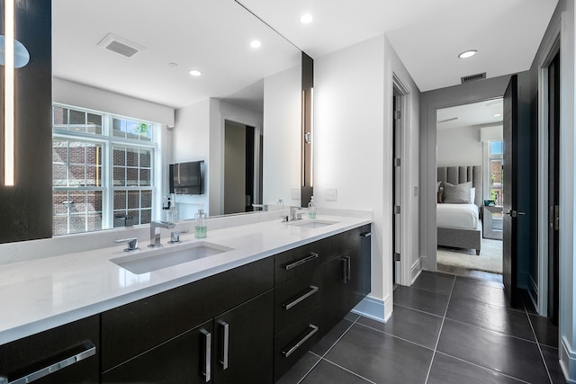 bathroom with tile floors and double sink vanity