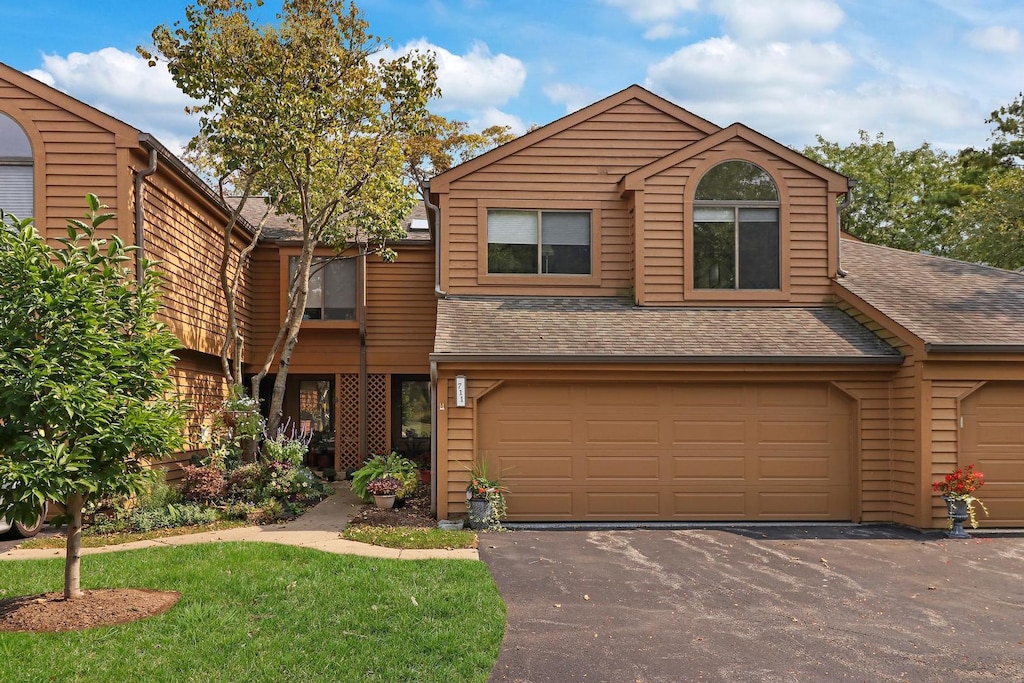 front of property with a garage