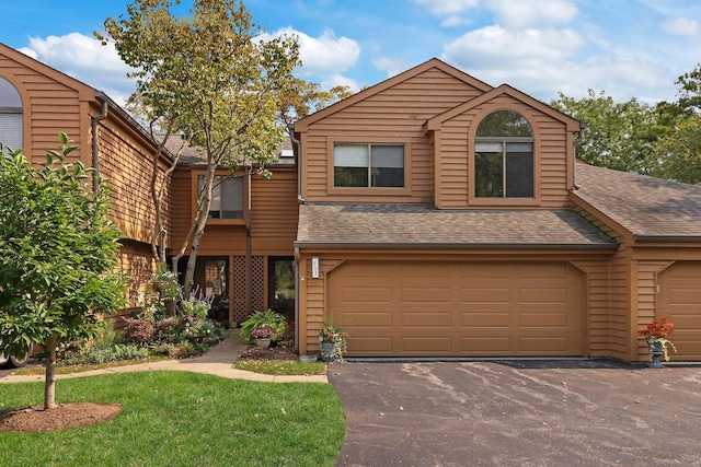 front of property with a garage