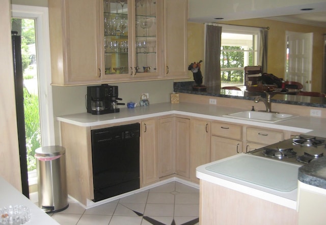 kitchen with light tile flooring, dishwasher, light brown cabinets, sink, and kitchen peninsula