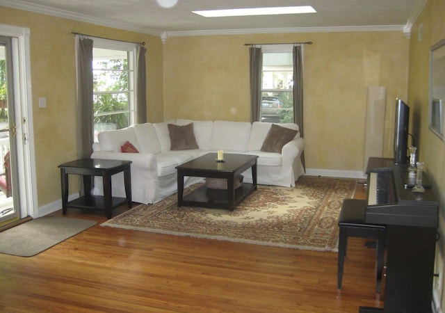 living room featuring hardwood / wood-style flooring and ornamental molding