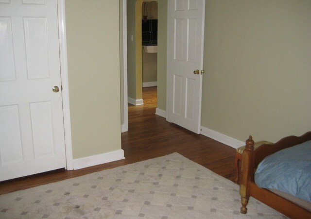 bedroom featuring wood-type flooring