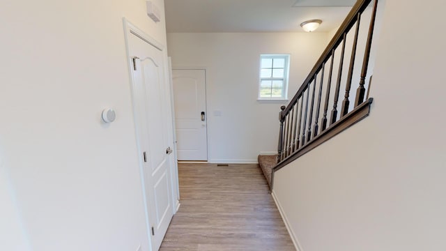 foyer with light hardwood / wood-style floors