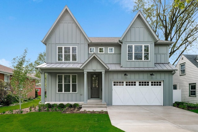 view of front facade with a front yard and a garage