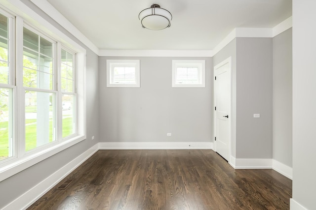 unfurnished room with dark hardwood / wood-style floors