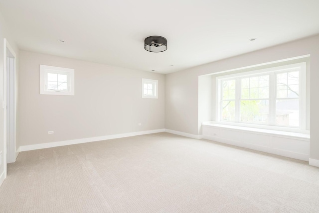 unfurnished room with light carpet