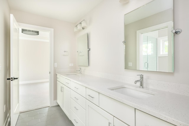 bathroom featuring tile flooring and double sink vanity