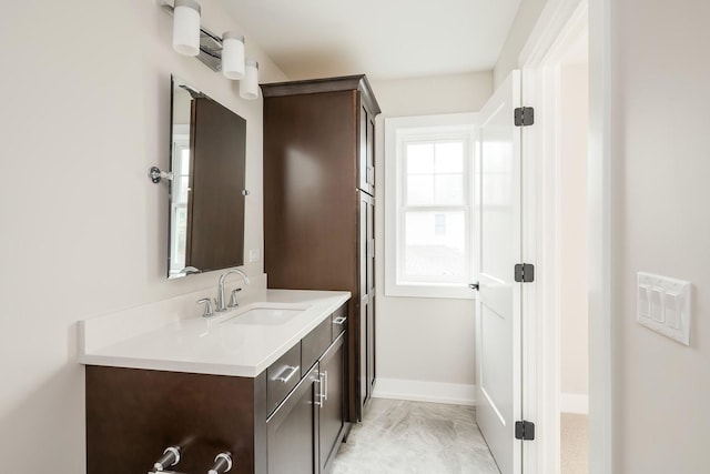 bathroom featuring tile flooring and vanity