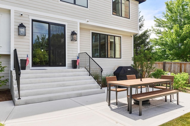 entrance to property featuring a patio area