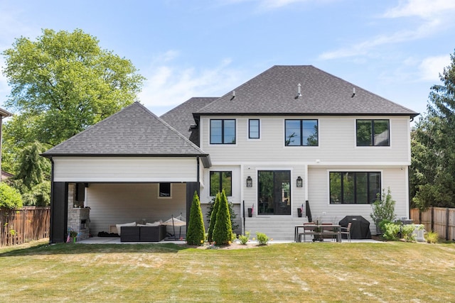 rear view of house featuring an outdoor hangout area, a patio area, and a yard