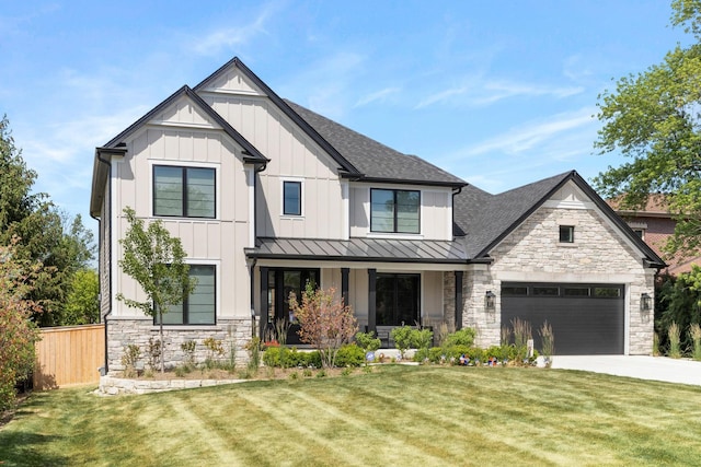 modern farmhouse style home featuring a front yard and a garage