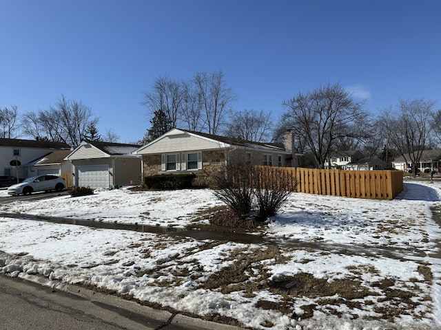 single story home with a garage