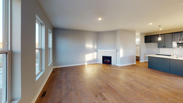 interior space with sink and light wood-type flooring