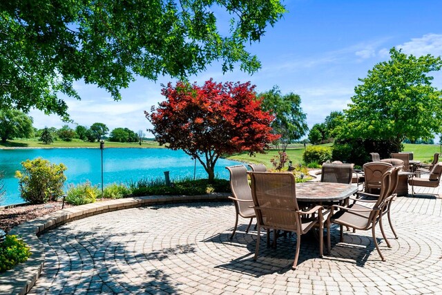 view of terrace with a water view