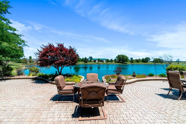 view of patio featuring a water view