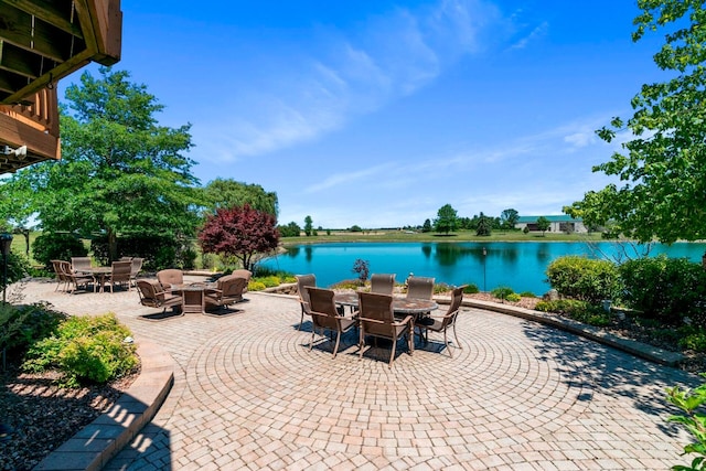 view of terrace with a water view