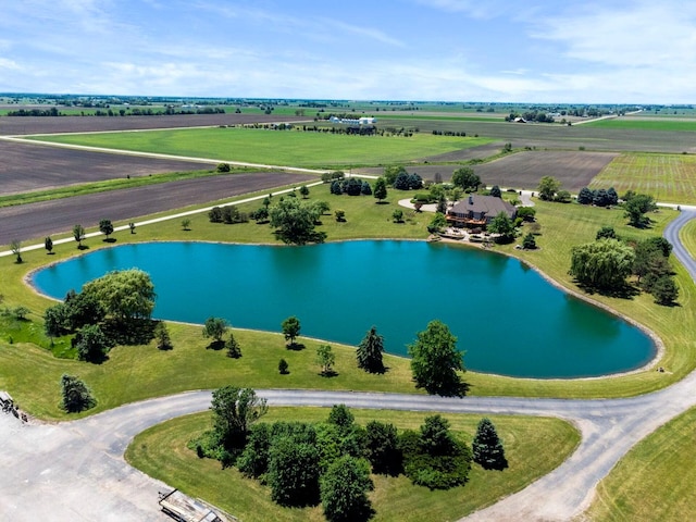 aerial view with a rural view and a water view