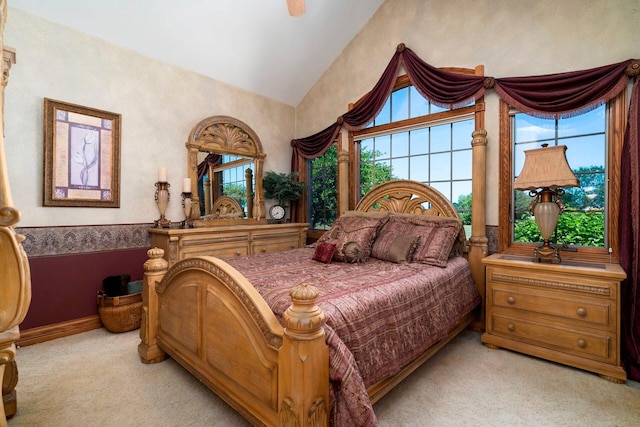 carpeted bedroom featuring lofted ceiling and ceiling fan