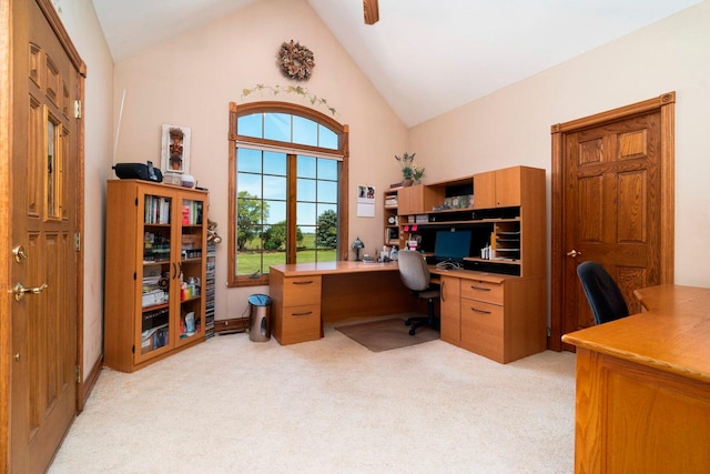 home office featuring light colored carpet, ceiling fan, and lofted ceiling