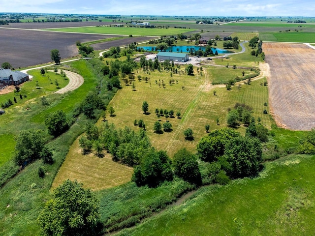 birds eye view of property featuring a rural view