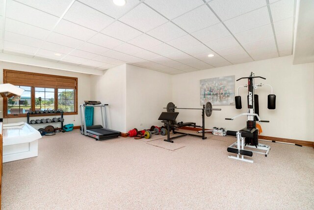 workout room with a paneled ceiling