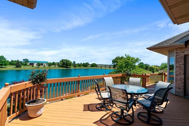 wooden deck featuring a water view