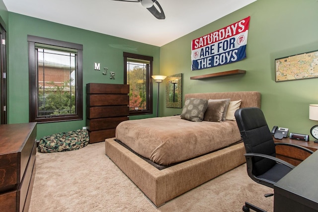 carpeted bedroom featuring ceiling fan