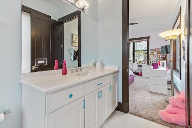 bathroom with tile floors and vanity