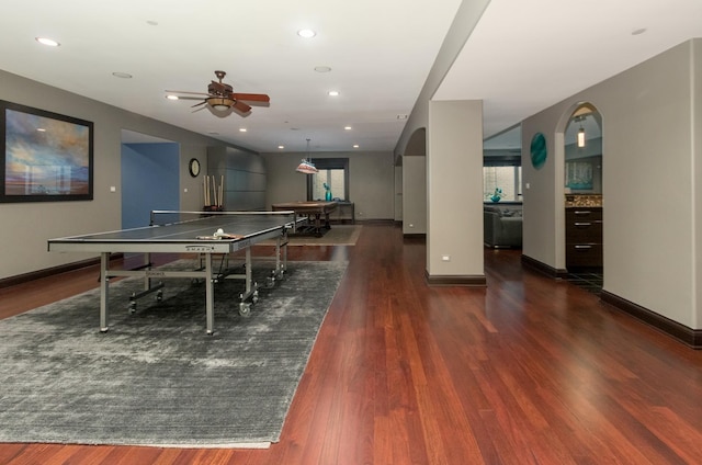 game room featuring dark hardwood / wood-style flooring, ceiling fan, and billiards