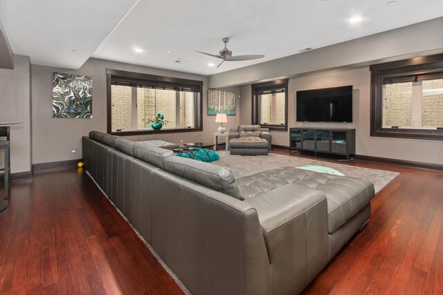 living room with dark hardwood / wood-style floors and ceiling fan