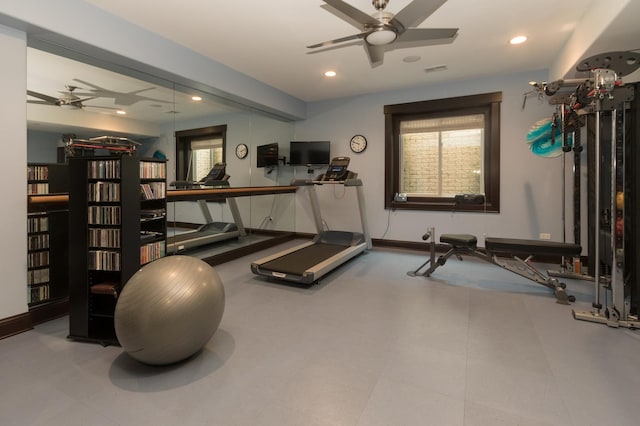 exercise area with ceiling fan and tile flooring