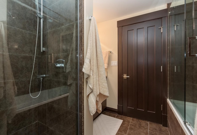 bathroom featuring shower / bath combination with glass door and tile floors